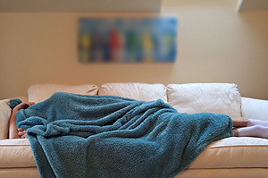 a person sleeping on a couch