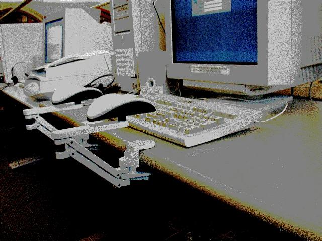 Diagram - armrests attached to desk in front of keyboard