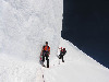 Tim and Jeff take a narrow path along an ice wall.