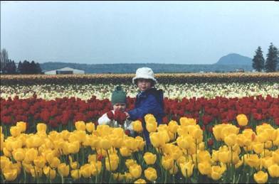 Photo of Terry's kids in a tulip field