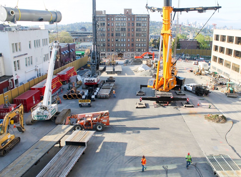 On the left is part of the new chiller being hoisted up.