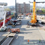 On the left is part of the new chiller being hoisted up.