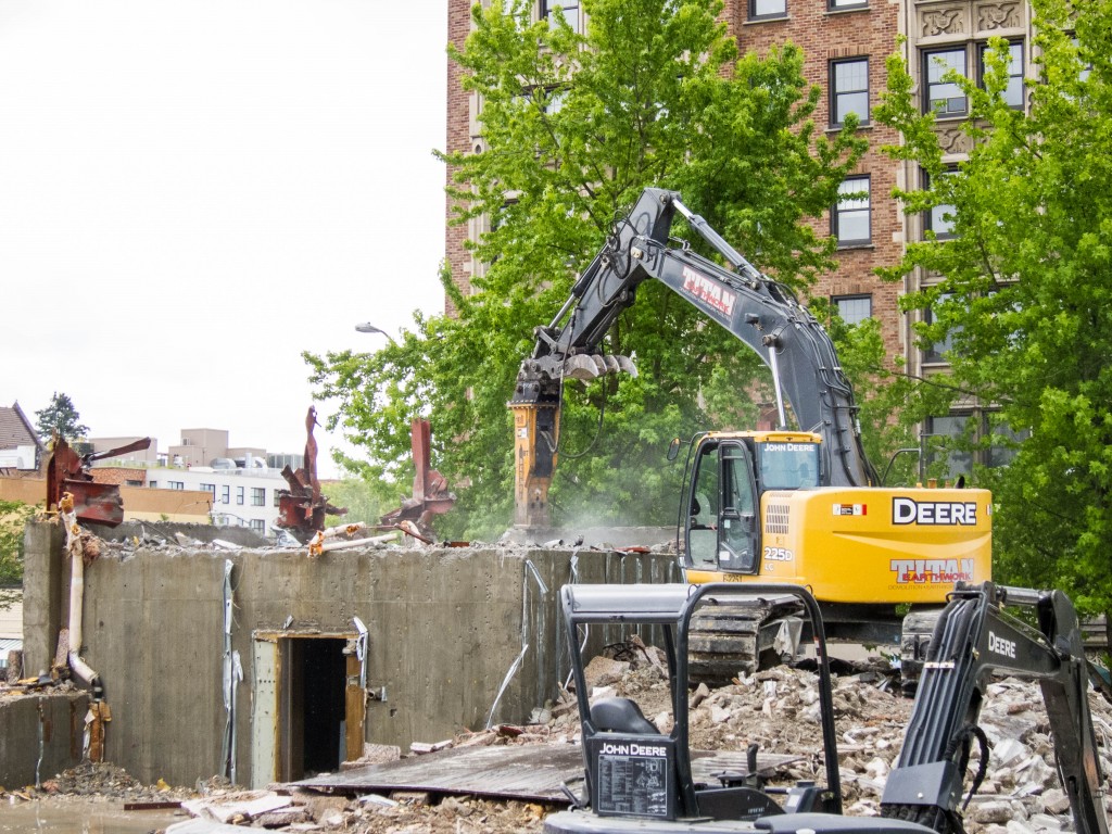 The concrete box is the bank vault. Its thick concrete walls soon yielded to the hydraulic breaker.