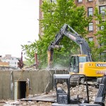 The concrete box is the bank vault. Its thick concrete walls soon yielded to the hydraulic breaker.