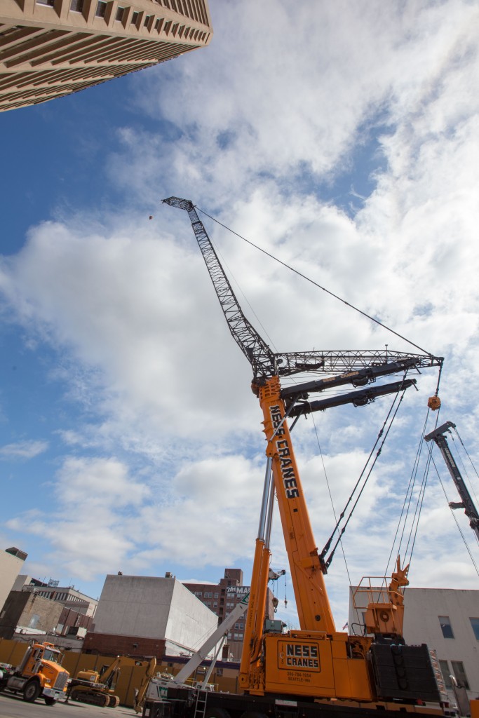 The main boom raised but not yet extended. It is a telescoping boom.