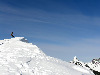 Jeff standing near a mini-couloir, surveying the scene.